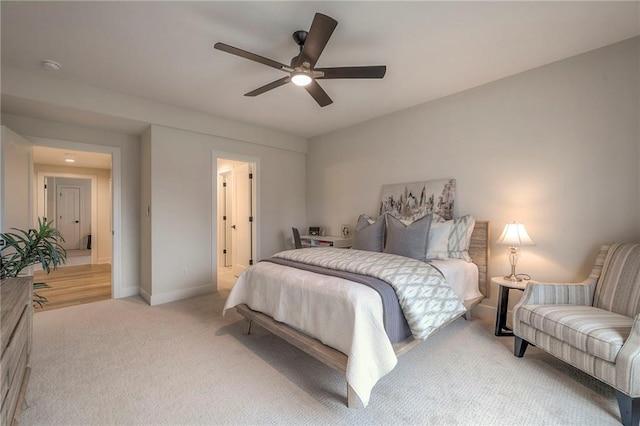 carpeted bedroom featuring ceiling fan