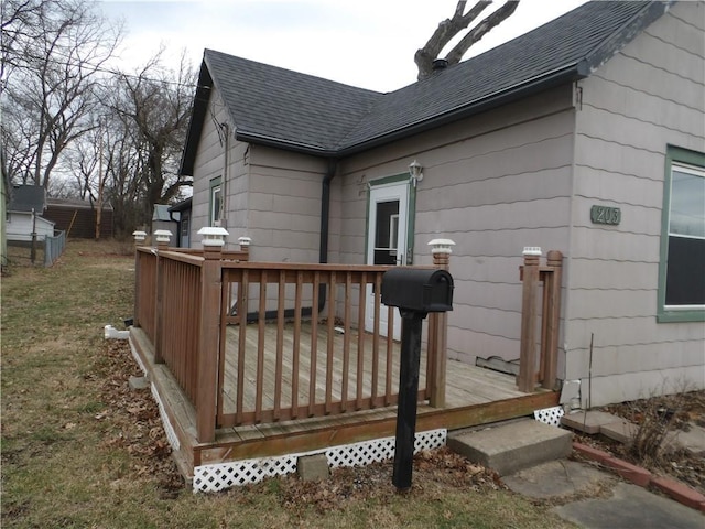 view of side of property with a wooden deck