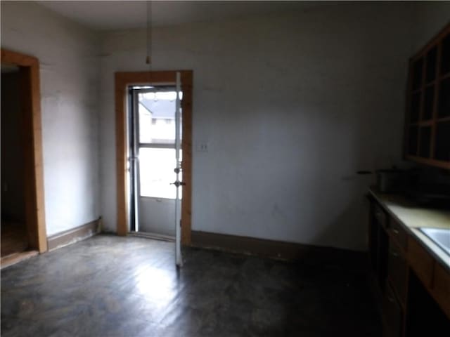 unfurnished dining area featuring sink