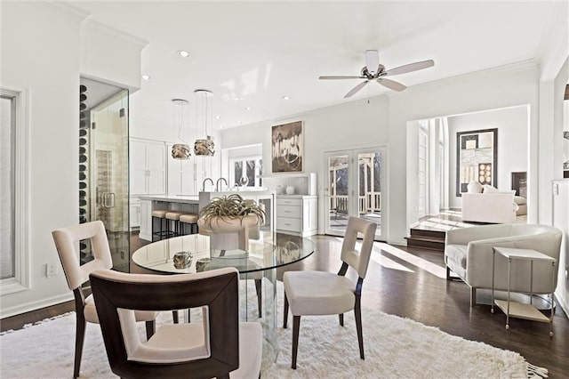 dining area with french doors, recessed lighting, dark wood-type flooring, ornamental molding, and ceiling fan