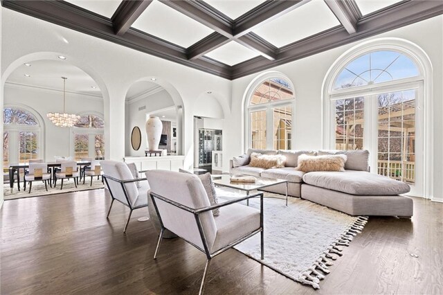 4101 W 123rd St, Leawood, KS 66209 - living area featuring plenty of natural light, ornamental molding, coffered ceiling, wood finished floors, and beamed ceiling