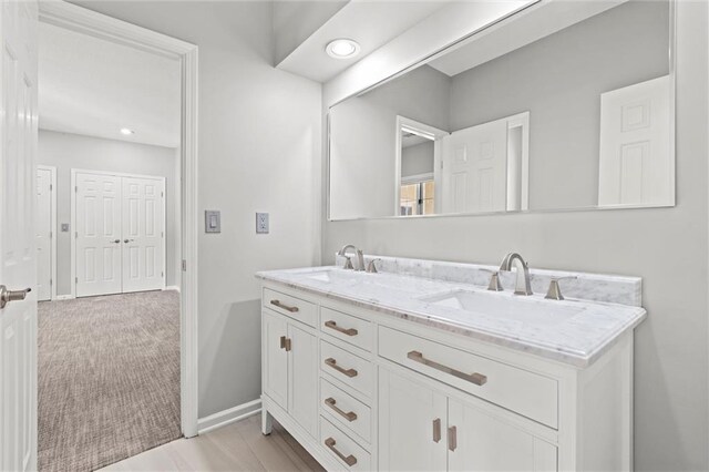 4101 W 123rd St, Leawood, KS 66209 - full bathroom featuring double vanity, recessed lighting, and baseboards