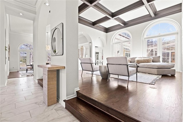 4101 W 123rd St, Leawood, KS 66209 - hall with a towering ceiling, ornamental molding, coffered ceiling, arched walkways, and beamed ceiling