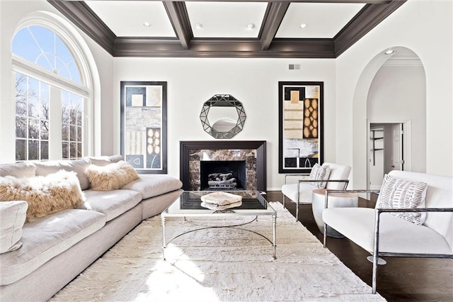 4101 W 123rd St, Leawood, KS 66209 - living room featuring ornamental molding, arched walkways, beam ceiling, wood finished floors, and coffered ceiling