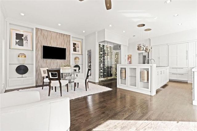 4101 W 123rd St, Leawood, KS 66209 - living area with crown molding, wood finished floors, ceiling fan, and recessed lighting