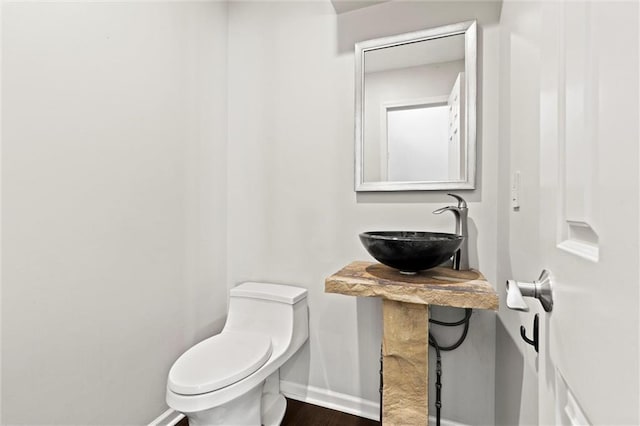4101 W 123rd St, Leawood, KS 66209 - half bath featuring a sink and wood finished floors