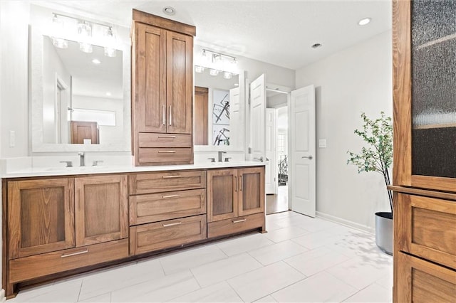 4101 W 123rd St, Leawood, KS 66209 - bathroom featuring double vanity and baseboards