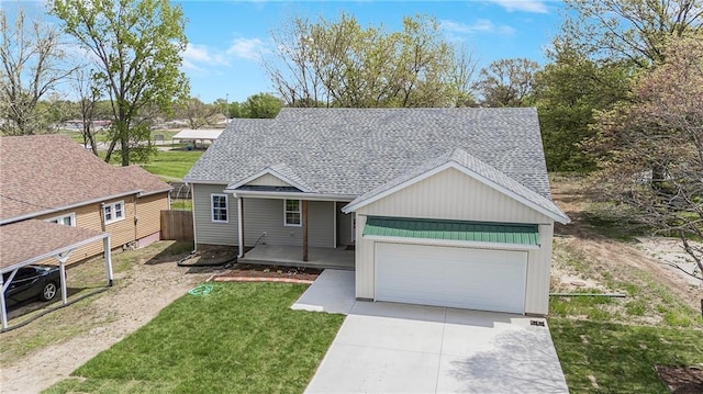 1013 S Main St, Holden, MO 64040 - single story home with concrete driveway, an attached garage, a porch, a front yard, and roof with shingles