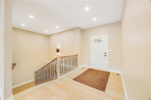 1013 S Main St, Holden, MO 64040 - foyer with recessed lighting, wood finished floors, visible vents, and baseboards