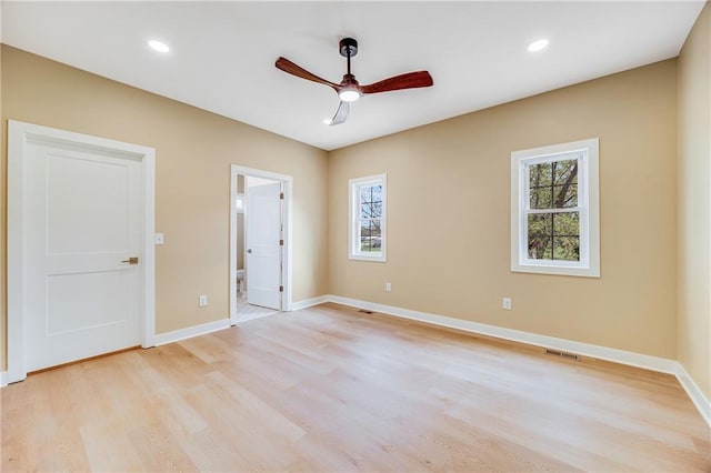 1013 S Main St, Holden, MO 64040 - unfurnished bedroom featuring light wood-style flooring, baseboards, and multiple windows