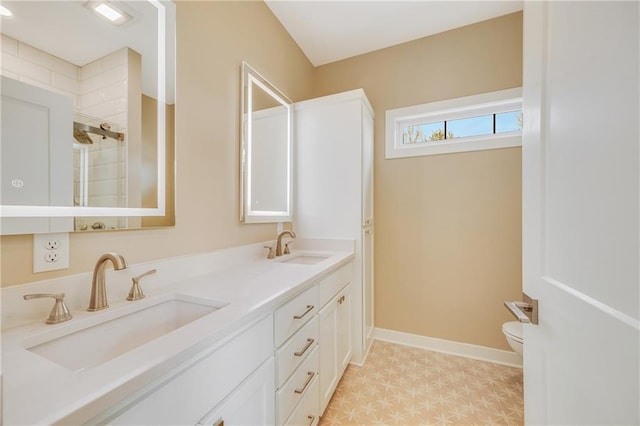 1013 S Main St, Holden, MO 64040 - bathroom with tile patterned floors, a sink, double vanity, and toilet