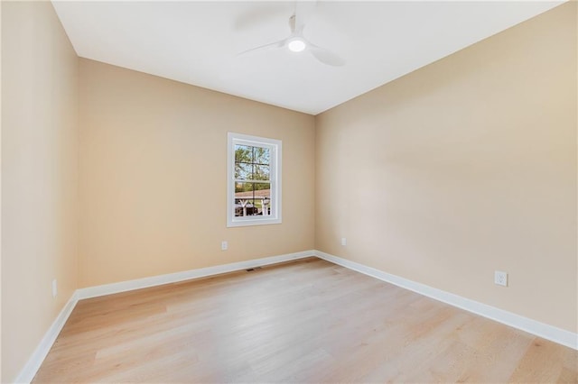 1013 S Main St, Holden, MO 64040 - unfurnished room with light wood-type flooring, a ceiling fan, and baseboards