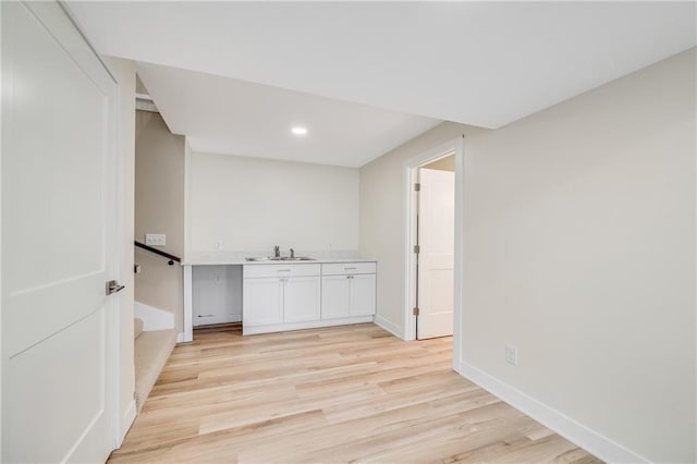 1013 S Main St, Holden, MO 64040 - interior space with light wood finished floors, recessed lighting, a sink, and baseboards