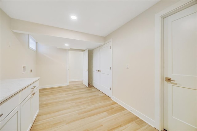 1013 S Main St, Holden, MO 64040 - below grade area with baseboards, light wood finished floors, and recessed lighting