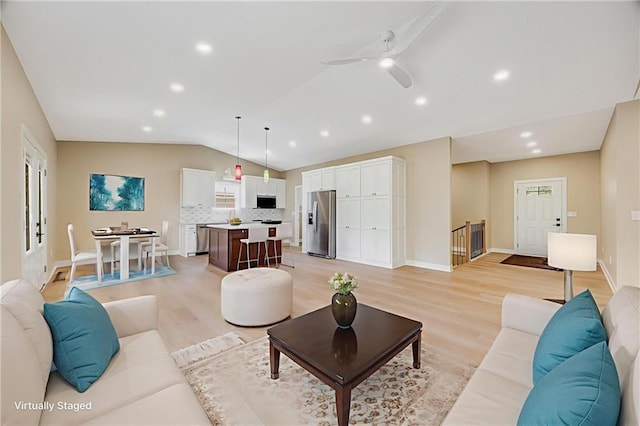 1013 S Main St, Holden, MO 64040 - living room featuring lofted ceiling, light wood-style floors, recessed lighting, and ceiling fan