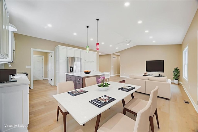 1013 S Main St, Holden, MO 64040 - dining space featuring light wood-style floors, lofted ceiling, and recessed lighting