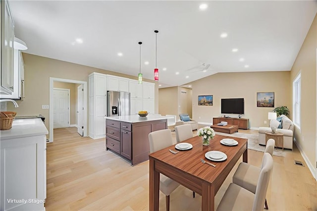 1013 S Main St, Holden, MO 64040 - dining area featuring light wood-type flooring, vaulted ceiling, and recessed lighting