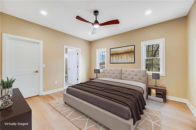 1013 S Main St, Holden, MO 64040 - bedroom with multiple windows, light wood-style floors, a ceiling fan, connected bathroom, and recessed lighting