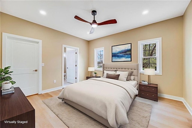 1013 S Main St, Holden, MO 64040 - bedroom with multiple windows, light wood finished floors, ensuite bathroom, recessed lighting, and a ceiling fan