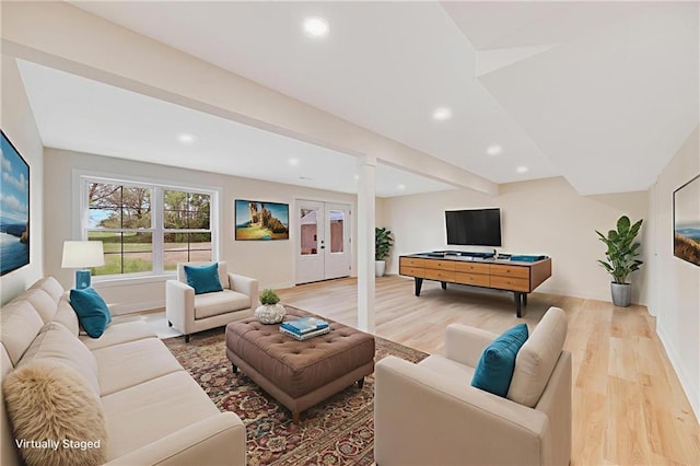 1013 S Main St, Holden, MO 64040 - living room with light wood-style flooring, recessed lighting, and french doors