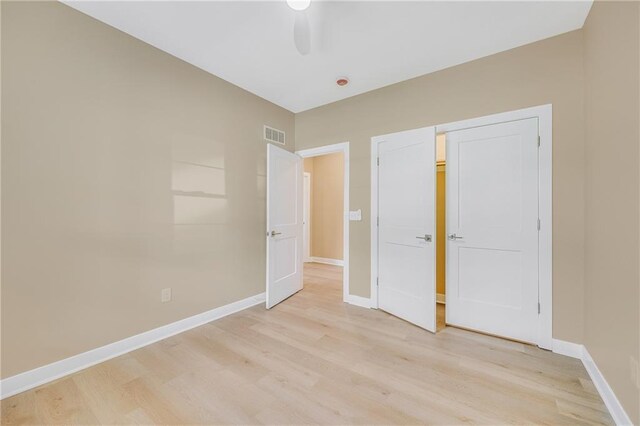 1013 S Main St, Holden, MO 64040 - unfurnished bedroom featuring light wood-type flooring and ceiling fan