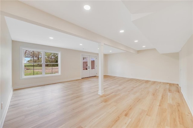 1013 S Main St, Holden, MO 64040 - below grade area with light wood finished floors, recessed lighting, and french doors