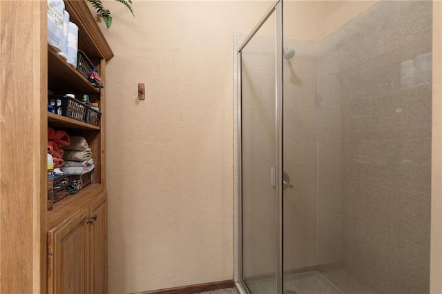 bathroom featuring a stall shower