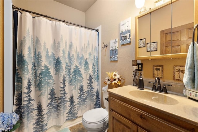 full bath with curtained shower, vanity, and toilet