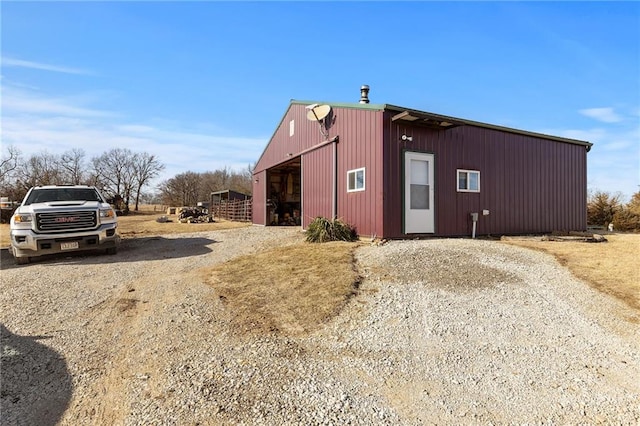 view of pole building featuring driveway