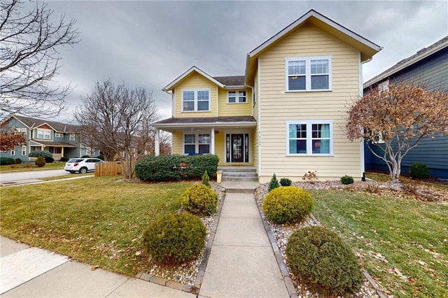 traditional-style house featuring a front yard