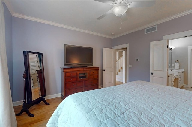 bedroom featuring visible vents, light wood-style floors, ornamental molding, ceiling fan, and baseboards