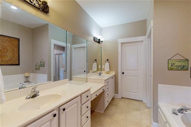 full bathroom featuring a bath, a stall shower, vanity, and baseboards