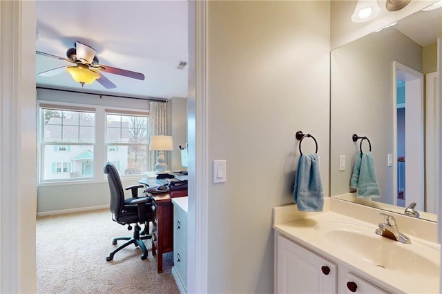 bathroom featuring ceiling fan, visible vents, baseboards, and vanity