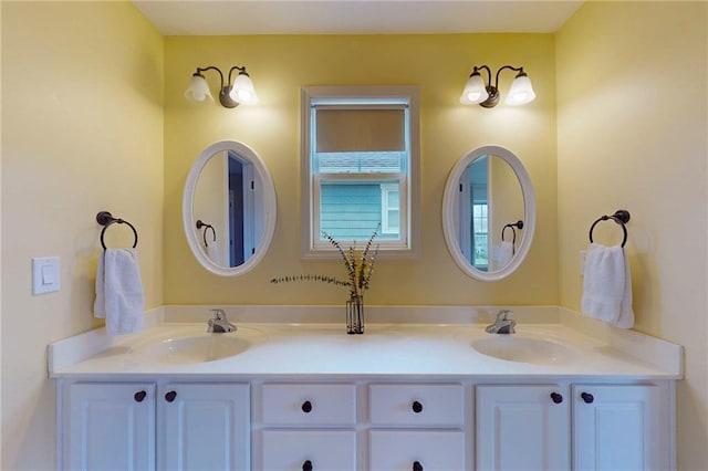 bathroom with double vanity and a sink