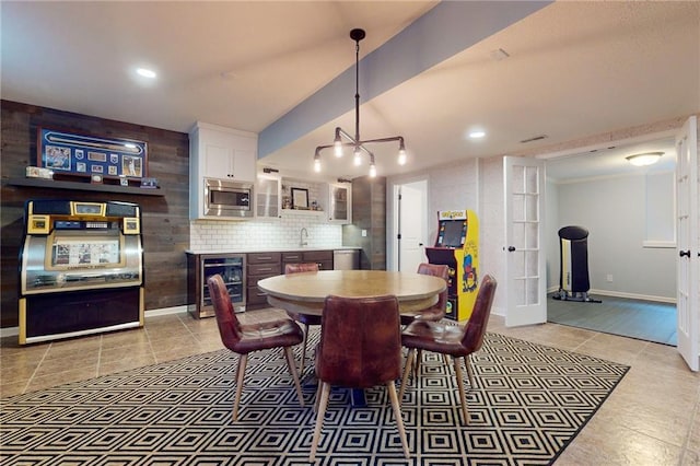 dining space with wine cooler, french doors, light tile patterned floors, recessed lighting, and baseboards