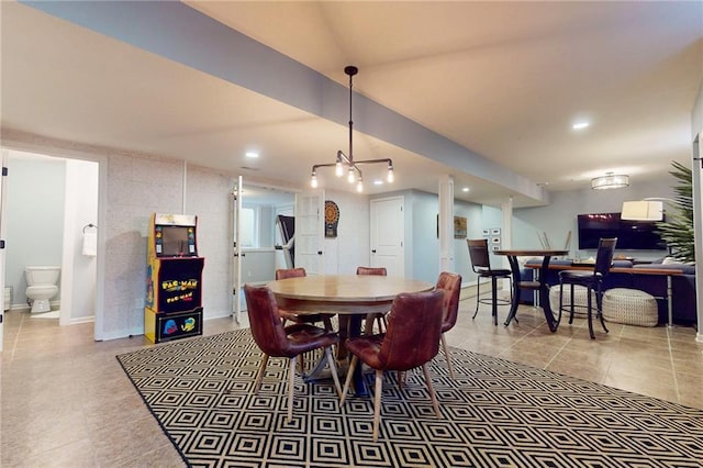 dining room featuring baseboards, tile patterned flooring, and recessed lighting