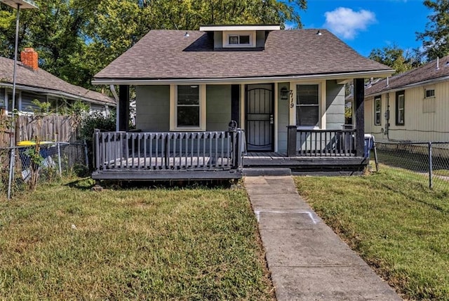 bungalow featuring a porch and a front yard