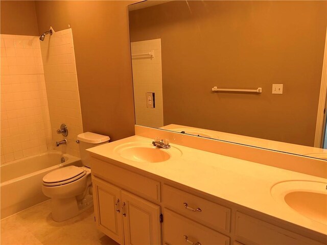 full bath featuring a sink, shower / bathtub combination, toilet, and double vanity