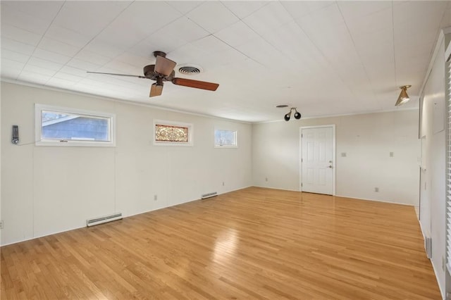 empty room with light wood finished floors and ceiling fan