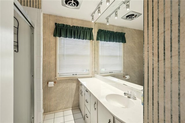full bathroom featuring vanity, tile patterned flooring, wallpapered walls, and an enclosed shower