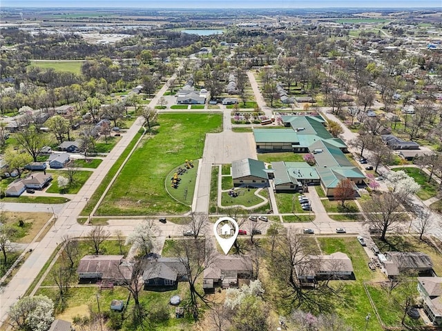 aerial view of property and surrounding area with nearby suburban area