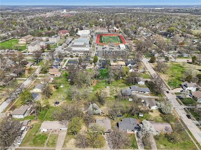aerial view of property's location with nearby suburban area