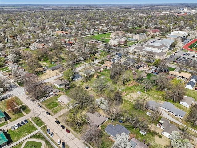 aerial view of property and surrounding area with nearby suburban area