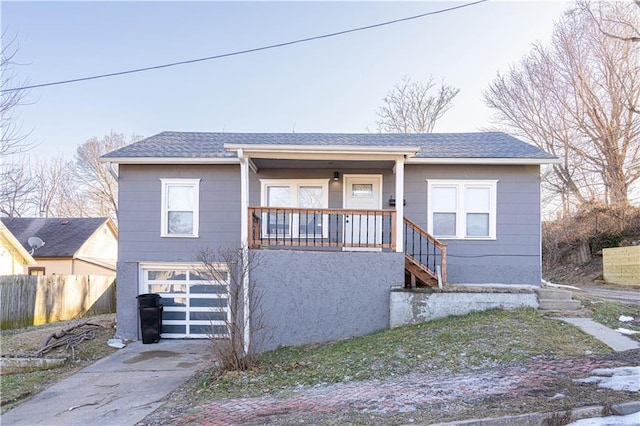 view of front of house with a garage and a porch