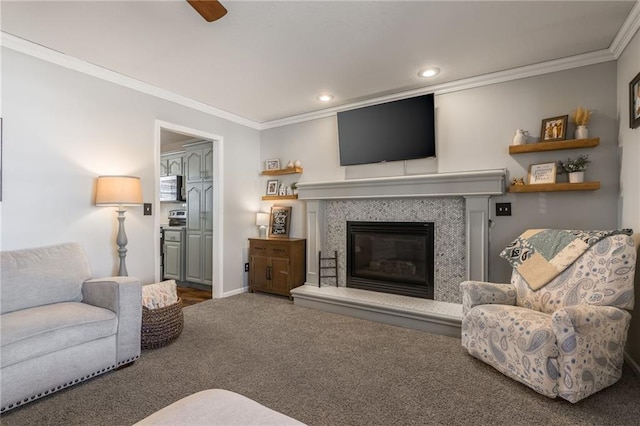 living area with recessed lighting, carpet floors, a high end fireplace, baseboards, and ornamental molding