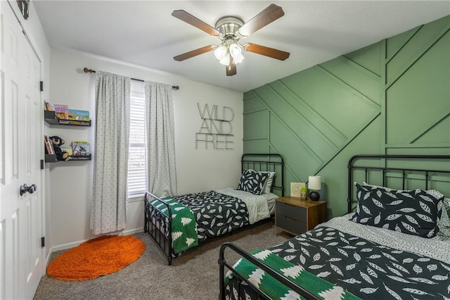 carpeted bedroom with ceiling fan