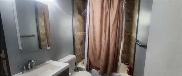 full bathroom featuring vanity, shower / tub combo, and toilet