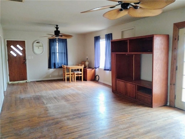 interior space with ceiling fan and light hardwood / wood-style flooring