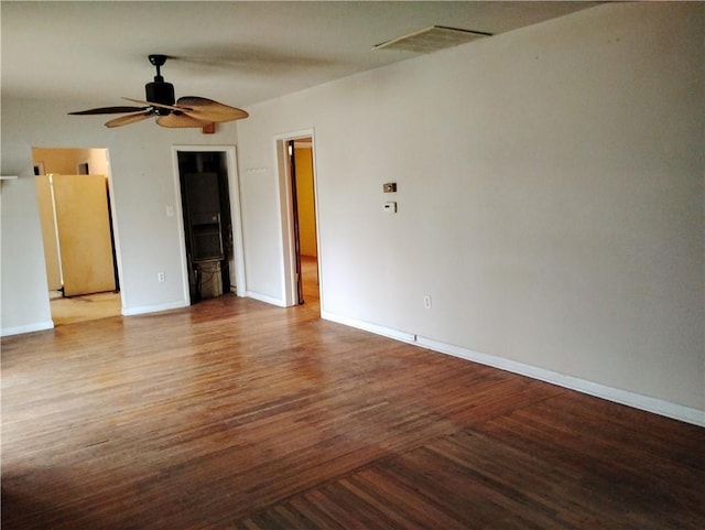 empty room featuring hardwood / wood-style floors and ceiling fan