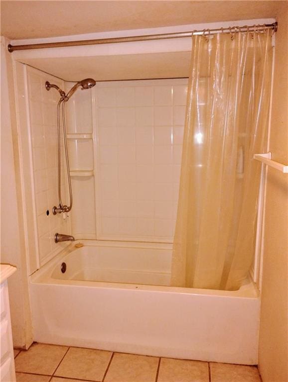 bathroom with shower / bath combo and tile patterned floors